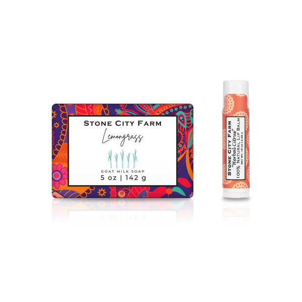 Lemongrass goat milk soap bar beside an Herbal Citrus lip balm